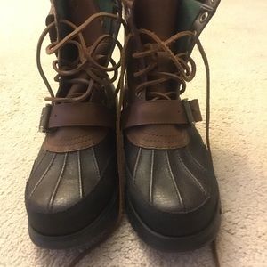 Brown and black polo boots